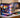 Custom gaming PC setup with vibrant RGB lighting and high-performance hardware displayed in a modern workspace