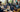Diverse creators working with powerful gaming laptops in a modern workspace, highlighting technology's impact on creativity